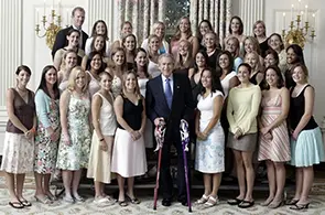 women athletes with a coach